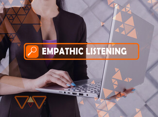  EMPATHIC LISTENING phrase on the screen. Bookkeeping clerk use internet technologies at office. Concept search and EMPATHIC LISTENING .