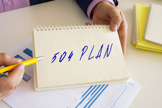 Financial concept about 504 PLAN with phrase on the notepad.