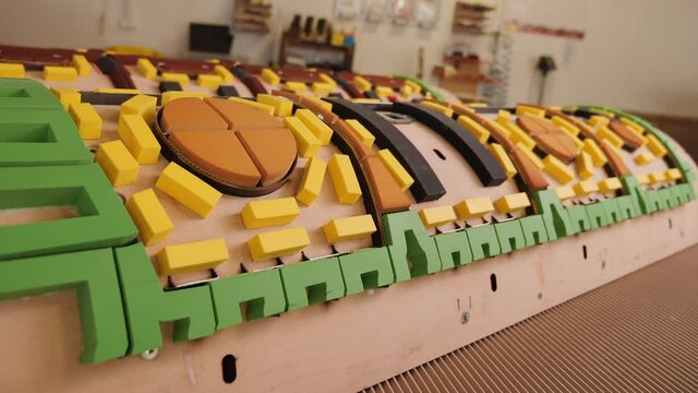 Roller die cutting and folding template tool for the packaging industry - close up, camera slide