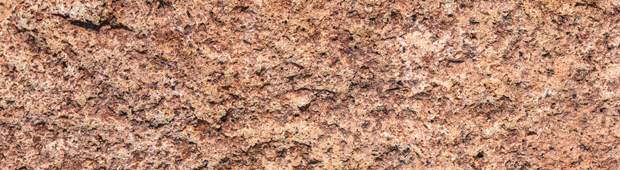 Closeup of rough textured rock as an abstract natural background
