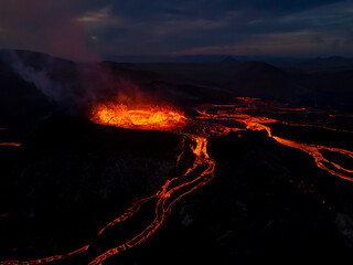 Beautiful aerial view at night of the Active Volcano with red Lava in Iceland