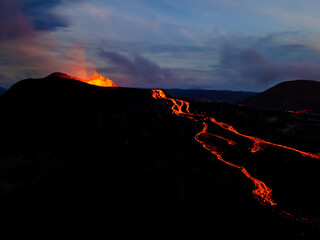 Beautiful aerial view at night of the Active Volcano with red Lava in Iceland