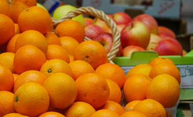 Oranges and apples for sale on a street market