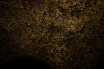 Gold-like reflections on the roof of the lava tubes
