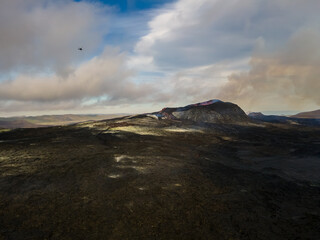 Beautiful aerial cinematic footage of the bowling lava exploding from the Active Volcano in Iceland
