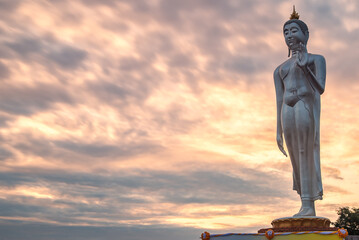 Big Buddha statue on sunset sky,Photos Buddha bless stood back in the evening light