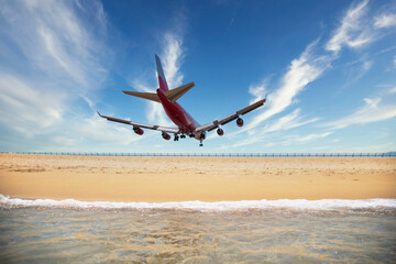 The plane is landing to phuket international airport at mai khao beach phuket thailand.