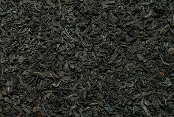 Close up view of black tea leaves, background