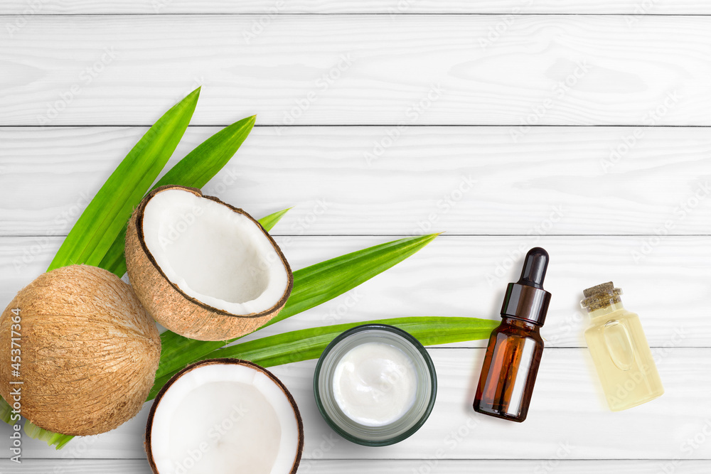 Wall mural skin care cream natural ingredient product with coconut fruit isolated on wooden table background. o - Wall murals