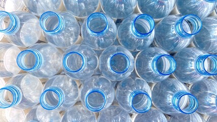 blue clear plastic unfilled drinking water bottle.