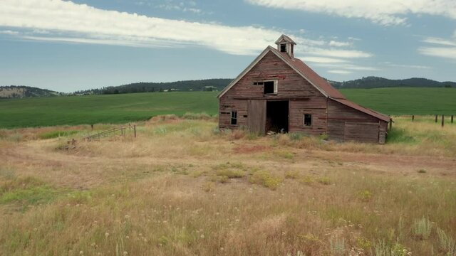 Aerial: Abandoned old barn and wheat farm, Valleyford, Washington, USA