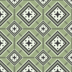 Geometric seamless ethnic traditional pattern in swithing rectangle style and crossing stripe line zigzag. Color of green tone. Design fabric background wallpaper vector carpet.