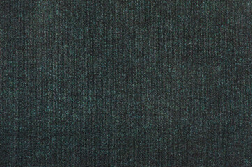 textured background of woolen fabric. Dark fabric. The structure of the wool, the background for the presentation. selective focus