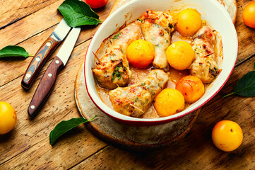 Chicken leg baked with plum and mushroom