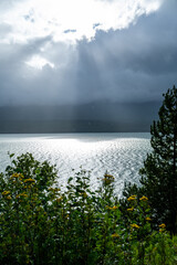sunrays through clouds over the kitsumkalum lake