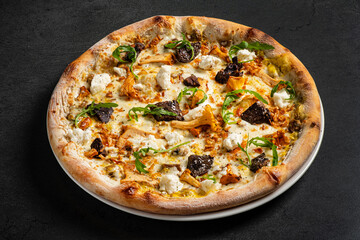 tasty pizza with chanterelles and vegetables