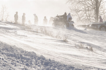 Rally spectators in cold winter day.