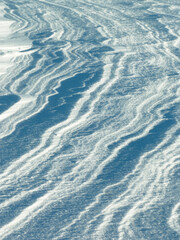 Play of sunlight on snowy waves.