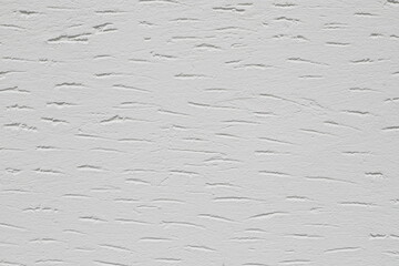 a white wall with rough plaster 