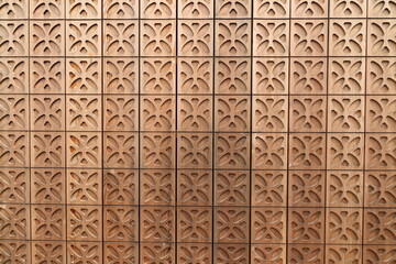 a wooden wall with a gingerbread pattern 