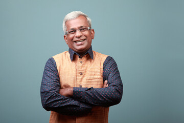 Happy smiling elderly man of Indian ethnicity