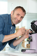 handyman repairs domestic coffee machine