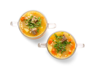 Bowls with tasty beef barley soup on white background