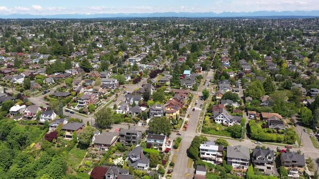 Cinematic 4K aerial drone pan shot of Sunset Hill, Loyal Heights, Adams, Ballard near Seattle, by Puget Sound in Washington