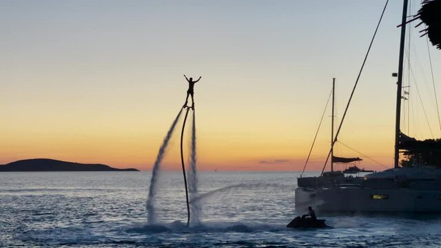 Flyboarding During Sunset In Hvar Island, Croatia. - wide shot