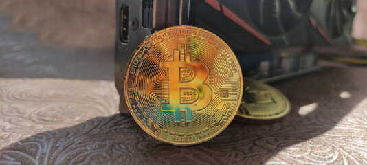 Bitcoin coin on the background of the video card.