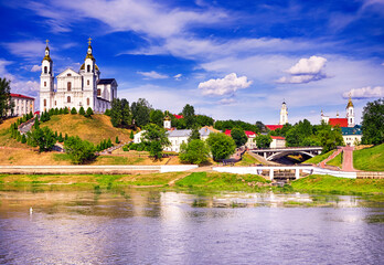Fototapeta na wymiar Travel Destinations Concepts. Cityscape of The Holy Assumption Cathedral, Resurrection Church With Holy Spirit Convent Across the Western Dvina River.