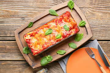 Composition with tasty tomato lasagna on wooden background - obrazy, fototapety, plakaty