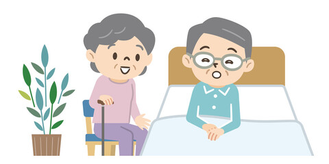 Obraz premium ベッドに横たわるシニア男性と妻