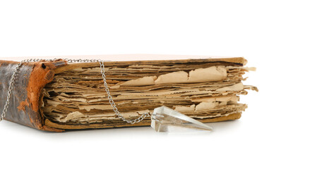 Old book and pendulum on white background