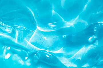 Cool Blue liquid cosmetic water gel smudged texture. Abstract clear cosmetic cream, hyaluronic...