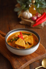 a bowl of spicy vegetable soup on the table 