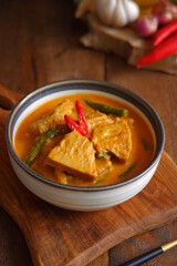 a bowl of spicy vegetable soup on the table 