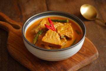 a bowl of spicy vegetable soup on the table 