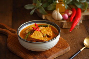 a bowl of spicy vegetable soup on the table 