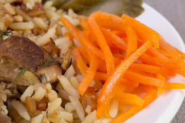 Rice pilaf with meat, carrot and raisins
