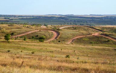 Fototapeta na wymiar Autumn landscape with a track for autocross.