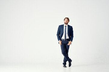 a man in a jacket and tie movement Jump light background