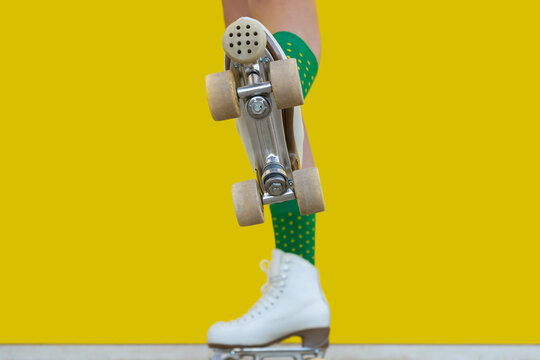 Bottom view of woman legs with quad roller skate step on camera