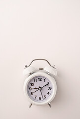 White retro alarm clock isolated on white background with copy space