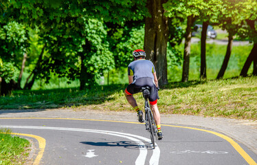Cyclist ride on the bike path in the city Park
