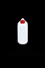 Tranparent empty plastic bottle with red cap