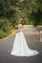 Fototapeta na wymiar Photo of a beautiful bride in a white dress.