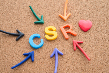 Corporate social responsibility (CSR) activities concept. Color highlight arrows around CSR...