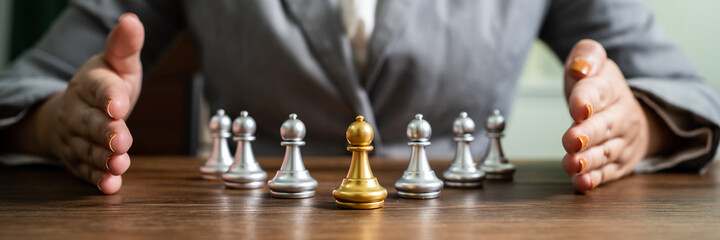 Chess leader and team. Human resources concept career management with clasped hands planning...