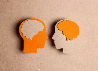 Cardboard profiles with brain symbol on a brown background.. World Multiple Sclerosis Day.